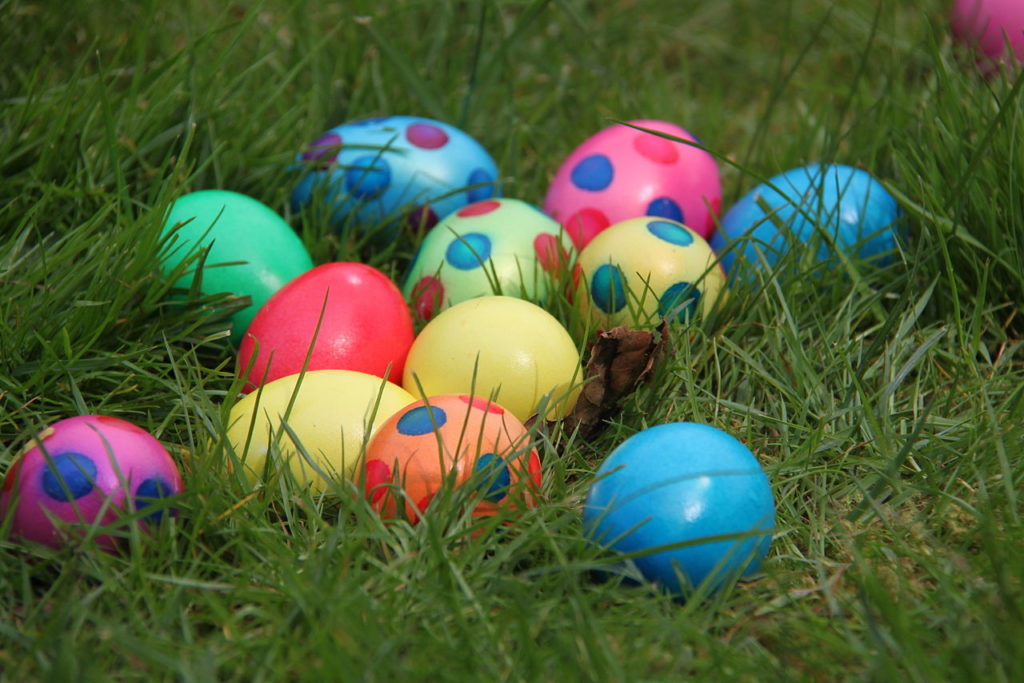 colorful easter eggs in a grassy lawn